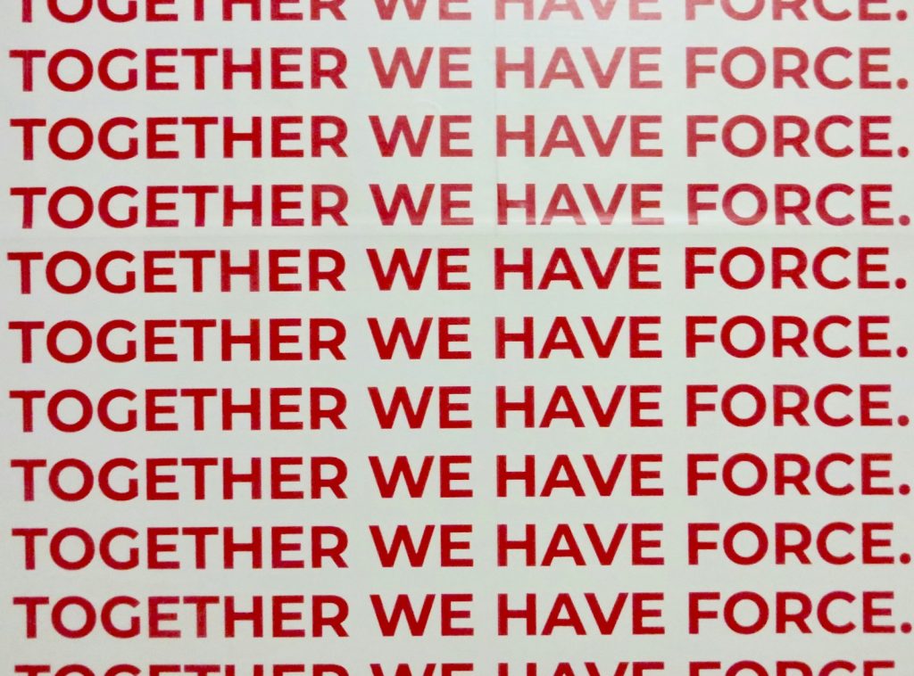 together we have force text overlay on white background